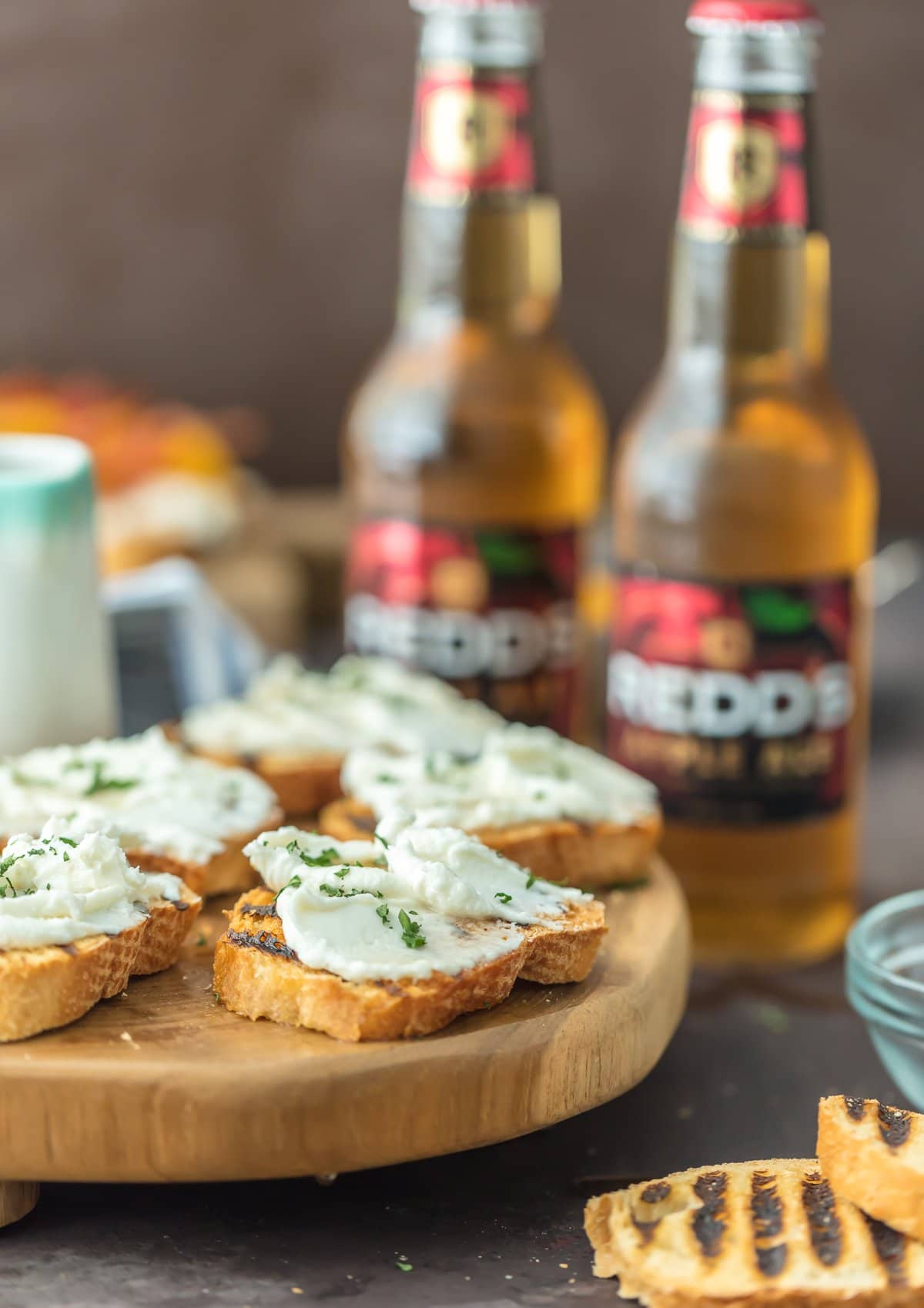 WHIPPED GOAT CHEESE CROSTINI made with an apple ale reduction is the perfect easy appetizer for any occasion. SO simple but so much flavor!!