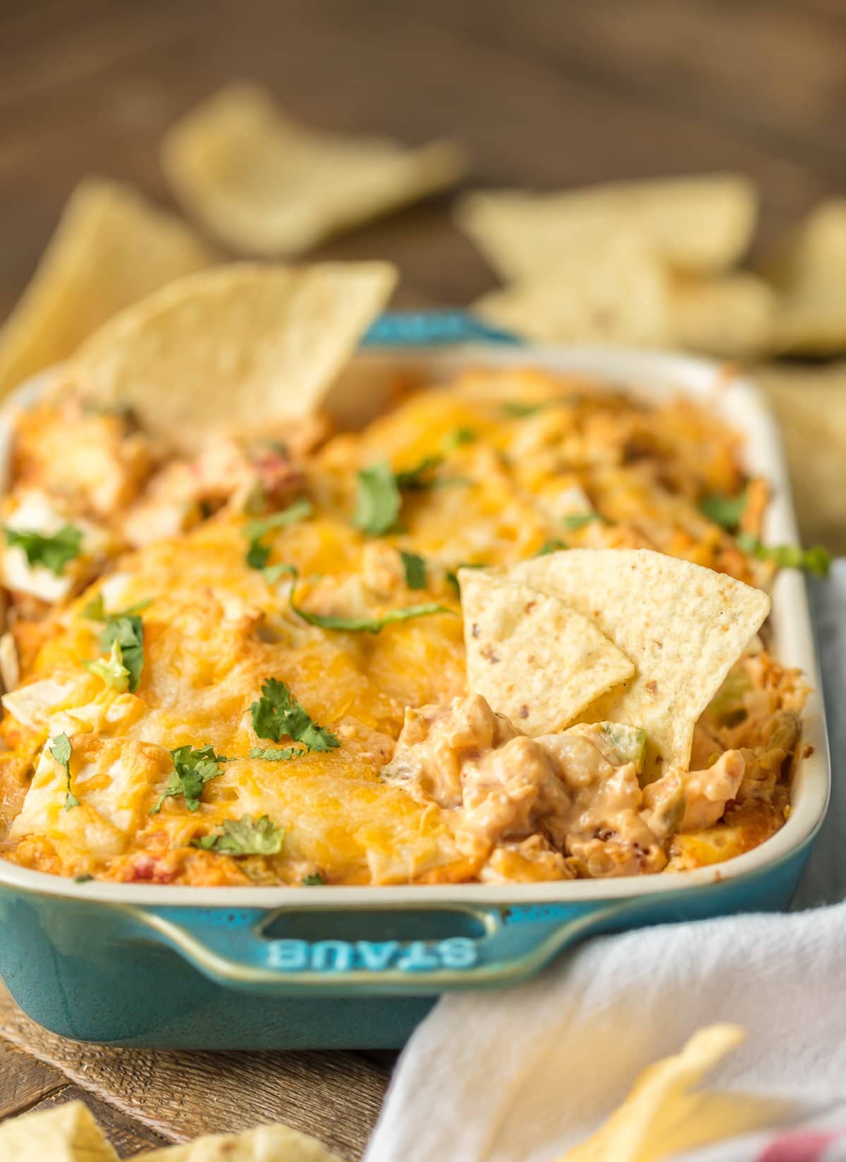 KING RANCH CHICKEN DIP is a fun twist on a classic family favorite casserole. The flavors including chicken, rotel, cheese, and tortillas lend themselves easily to a delicious dip, just perfect for the Super Bowl!